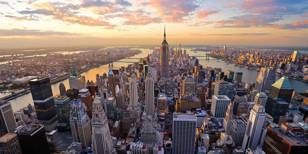 A helicopter flying above New York City's stunning skyline.