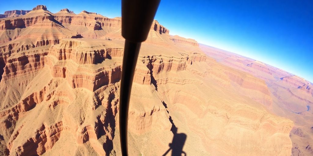 Helicopter flying over the Grand Canyon's stunning landscape.