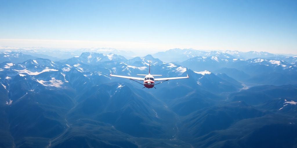 A drone flying over snow-covered Alaskan mountains and glaciers.